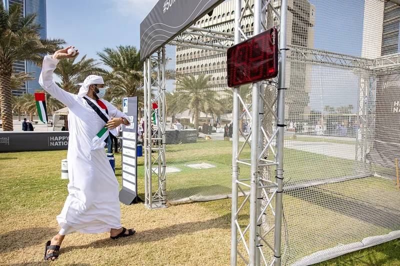 Employee and family activity area set against Abu Dhabi’s landmark ADNOC tower