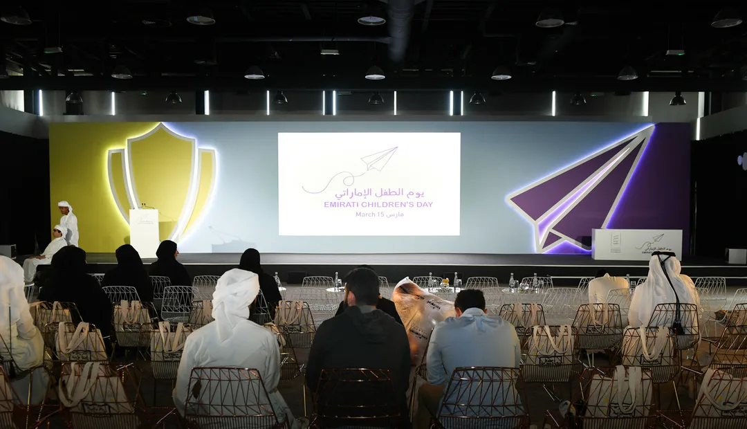 Main performance stage featuring vibrant LED video screens and interactive children's show set