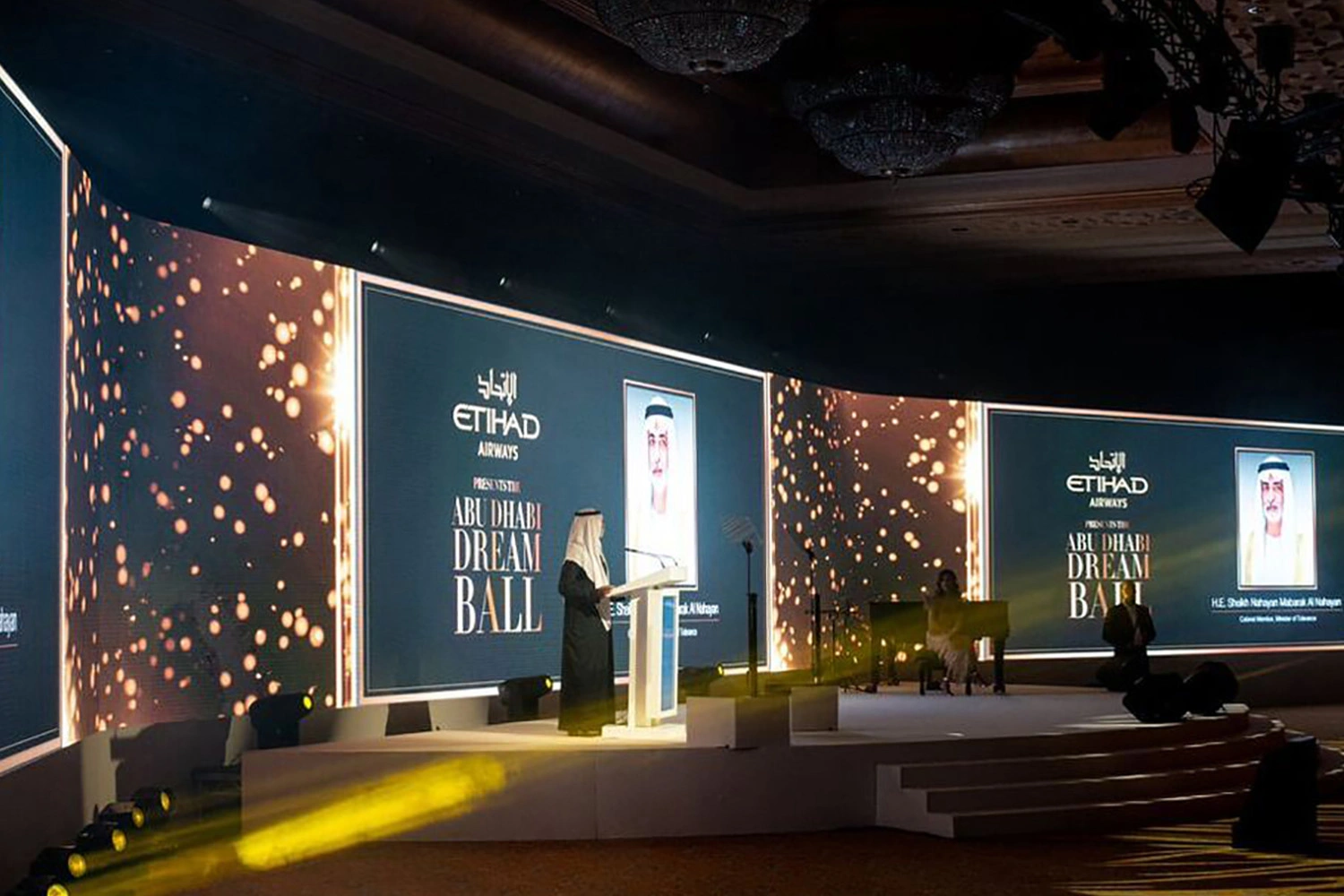 Art Deco furniture, gold table layers, pampas centrepieces, media walls and auction galleries created an elegant fundraising setting within a charitable budget.