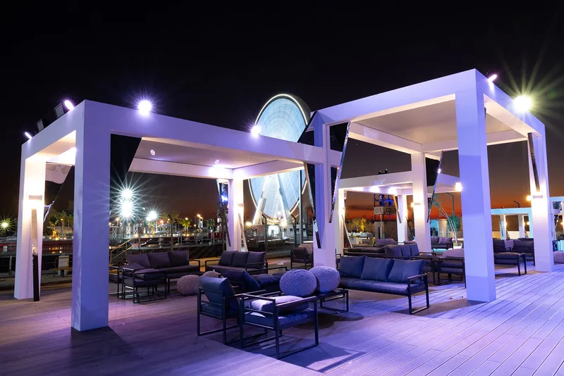 Outdoor VIP hospitality terrace overlooking central performance arena in Diriyah Riyadh