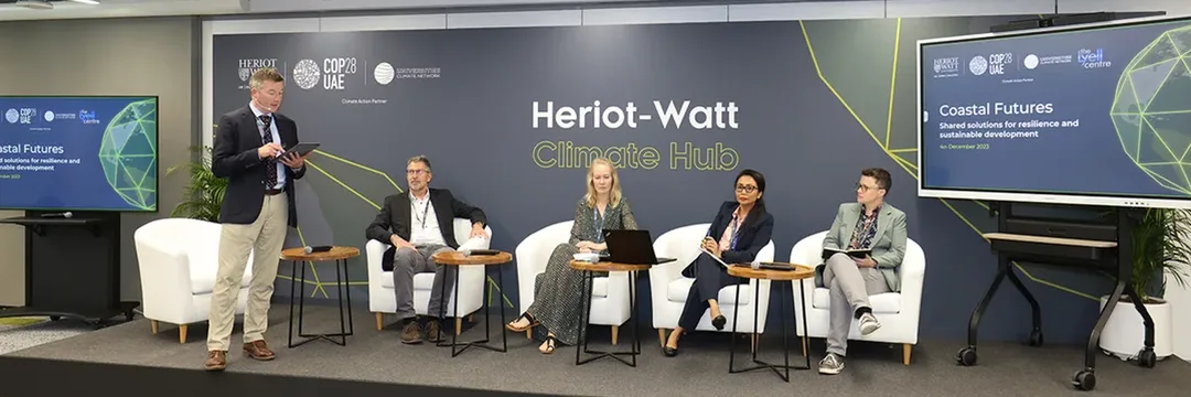 A two-week climate hub transformed through scenic design, furniture, signage and communication materials into a platform for international dialogue.