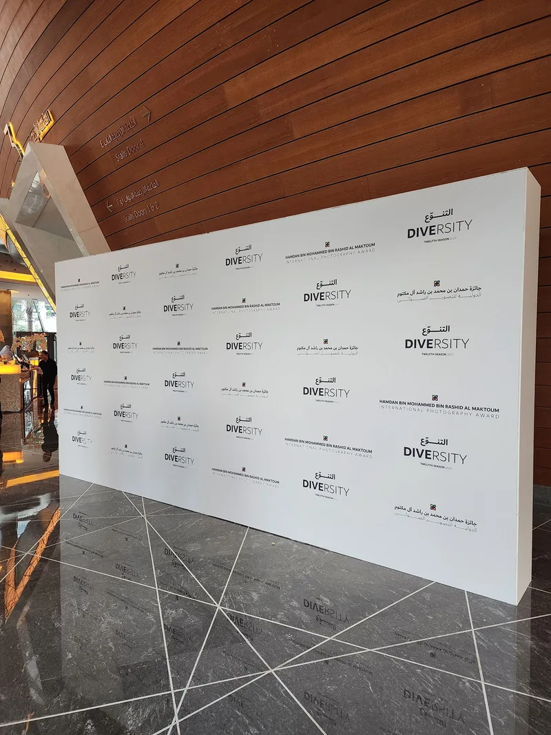 Media press conference room with branded photo backdrop wall for winning photographers
