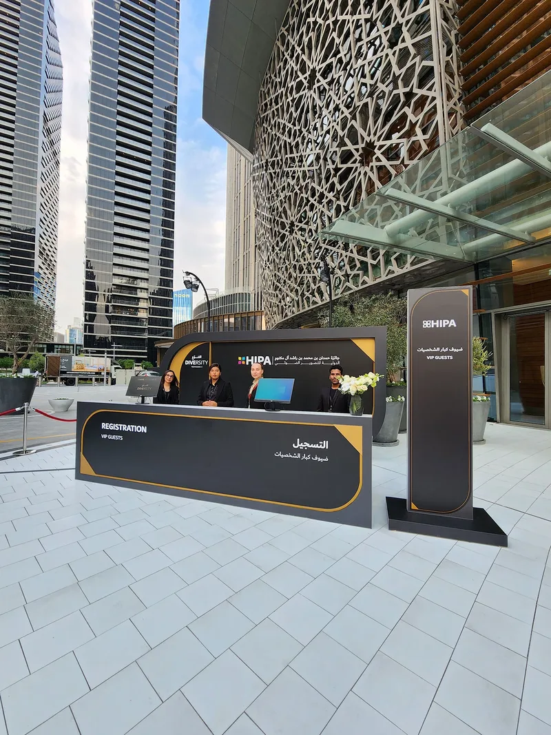 Evolution Events HIPA VIP registration desk with branded signage and guest services team