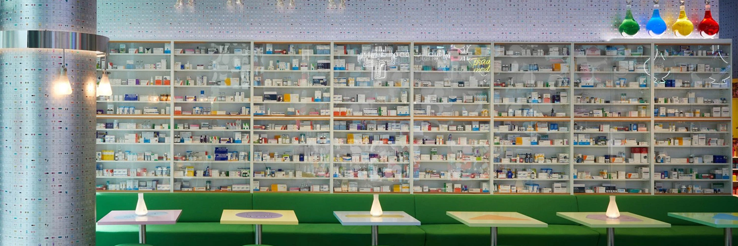 Damien Hirst’s Pharmacy transformed into an immersive social-club environment through a sculptural bar, medical cabinet, DNA installation and complete venue treatment.