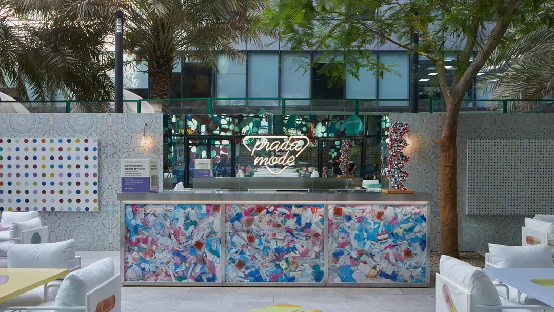 Custom cocktail bar with mirrored frontage and backlit spirits display shelving