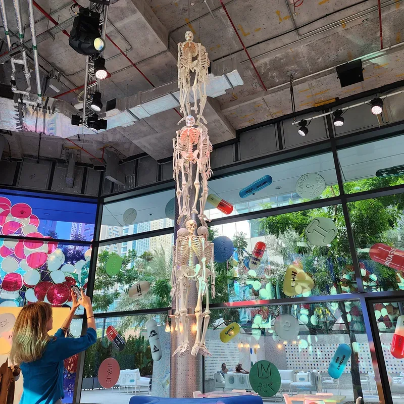 Suspended anatomical sculpture and immersive installation at Prada Mode Dubai