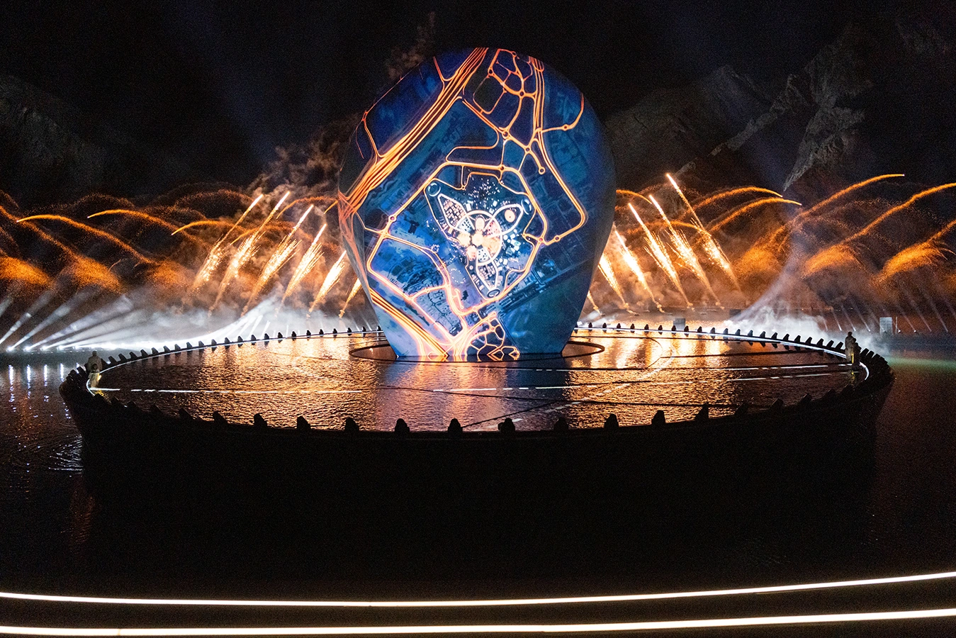 Monumental floating stage structure built over water for national day theatrical performance